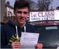 Robbie with Driving test pass certificate